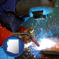 arizona an industrial welder wearing a welding helmet and safety gloves