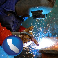 california an industrial welder wearing a welding helmet and safety gloves