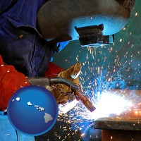 hawaii an industrial welder wearing a welding helmet and safety gloves