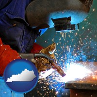kentucky an industrial welder wearing a welding helmet and safety gloves