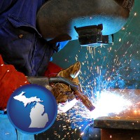 michigan an industrial welder wearing a welding helmet and safety gloves