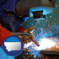 montana an industrial welder wearing a welding helmet and safety gloves