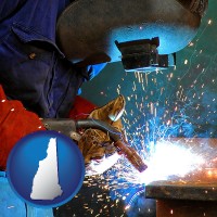 new-hampshire an industrial welder wearing a welding helmet and safety gloves