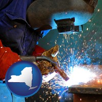 new-york an industrial welder wearing a welding helmet and safety gloves