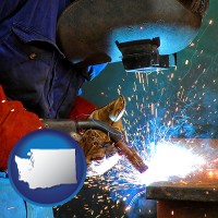 washington an industrial welder wearing a welding helmet and safety gloves