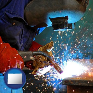 an industrial welder wearing a welding helmet and safety gloves - with Colorado icon