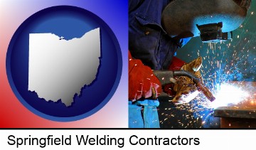 an industrial welder wearing a welding helmet and safety gloves in Springfield, OH