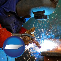 tennessee an industrial welder wearing a welding helmet and safety gloves